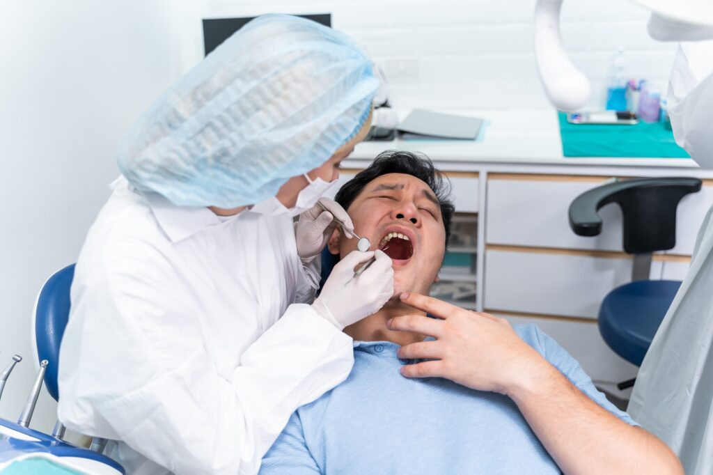 Dentist treating a dental emergency patient in Orlando at Crescent Dental